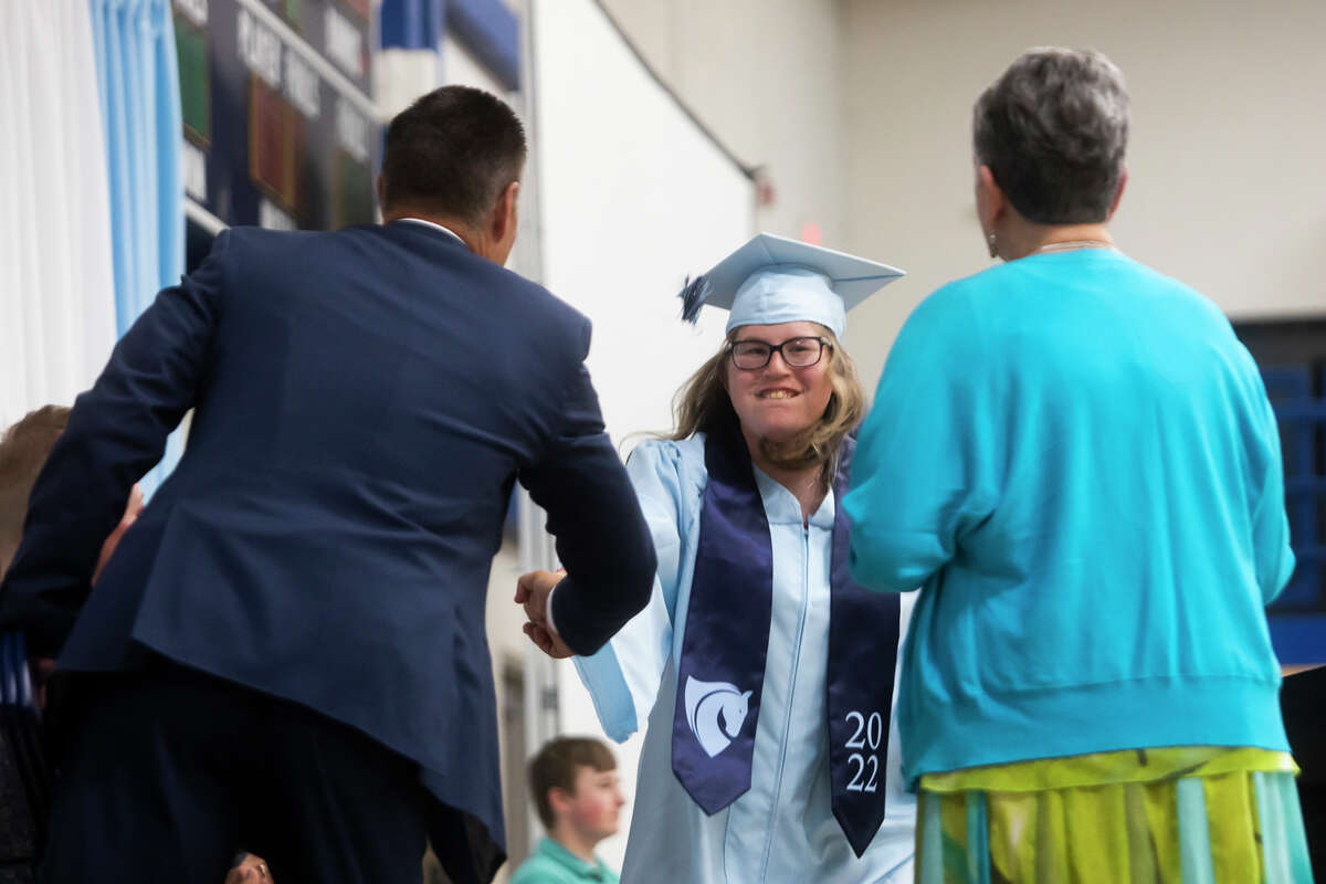 Raja Danae Pacholka receives her diploma as the Meridian Early College High School Class of 2022 celebrate their commencement Thursday, May 19, 2022 at the school in Sanford.