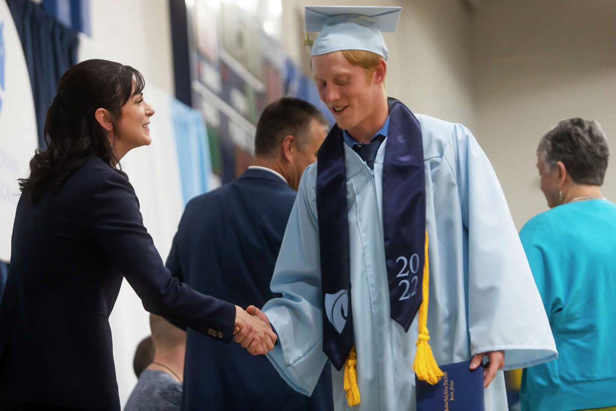 Raja Danae Pacholka receives her diploma as the Meridian Early College High School Class of 2022 celebrate their commencement Thursday, May 19, 2022 at the school in Sanford.