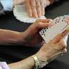 The Perfectly Polite Bridge Group plays cards at the YMCA in Greenwich, Conn on Wednesday, June 27, 2018.