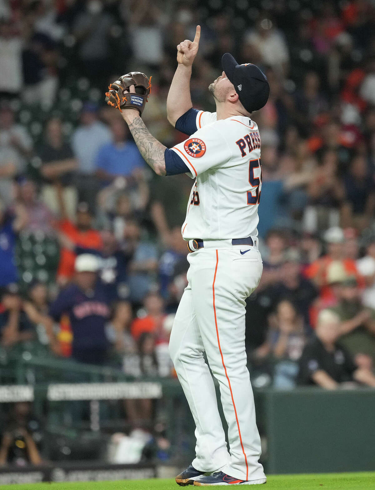 Houston Astros relief pitcher Ryan Pressly (55) reacts after striking out Texas Rangers Brad Miller (13) to end an MLB game at Minute Maid Park on Thursday, May 19, 2022 in Houston. Astros won 5-1.