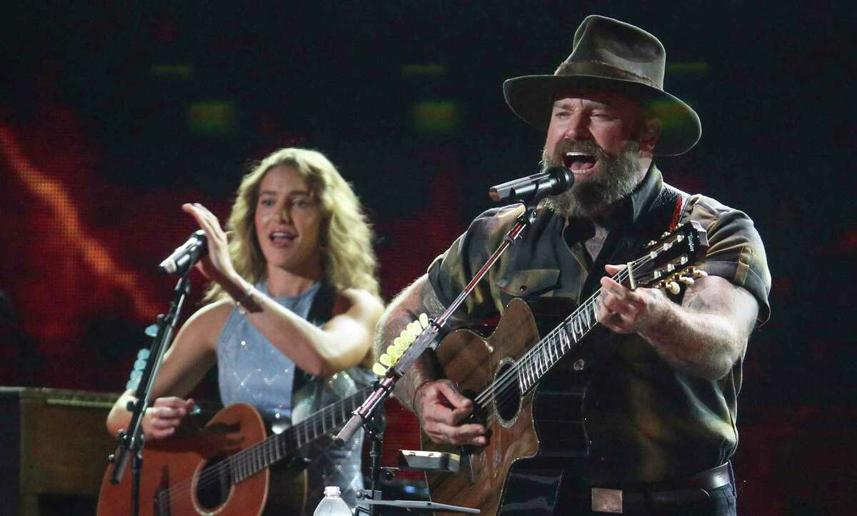 Caroline Jones joins Zac Brown onstage for Zac Brown Band’s performance earlier this month at the iHeartCountry Festival in Austin. The band plays San Antonio on Sunday.