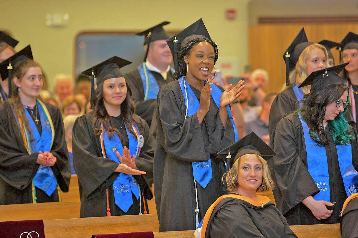 Graduating students celebrate during commencement ceremonies for St. John’s College of Nursing in Springfield.