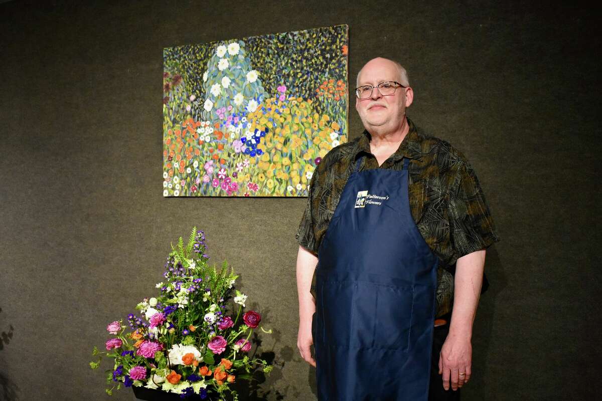 Artworks recently debuted the 'Bloomin' Crazy' exhibit which features floral arrangements put together by Bob Patterson (pictured) of Patterson's Flowers that were inspired by unique art pieces. 