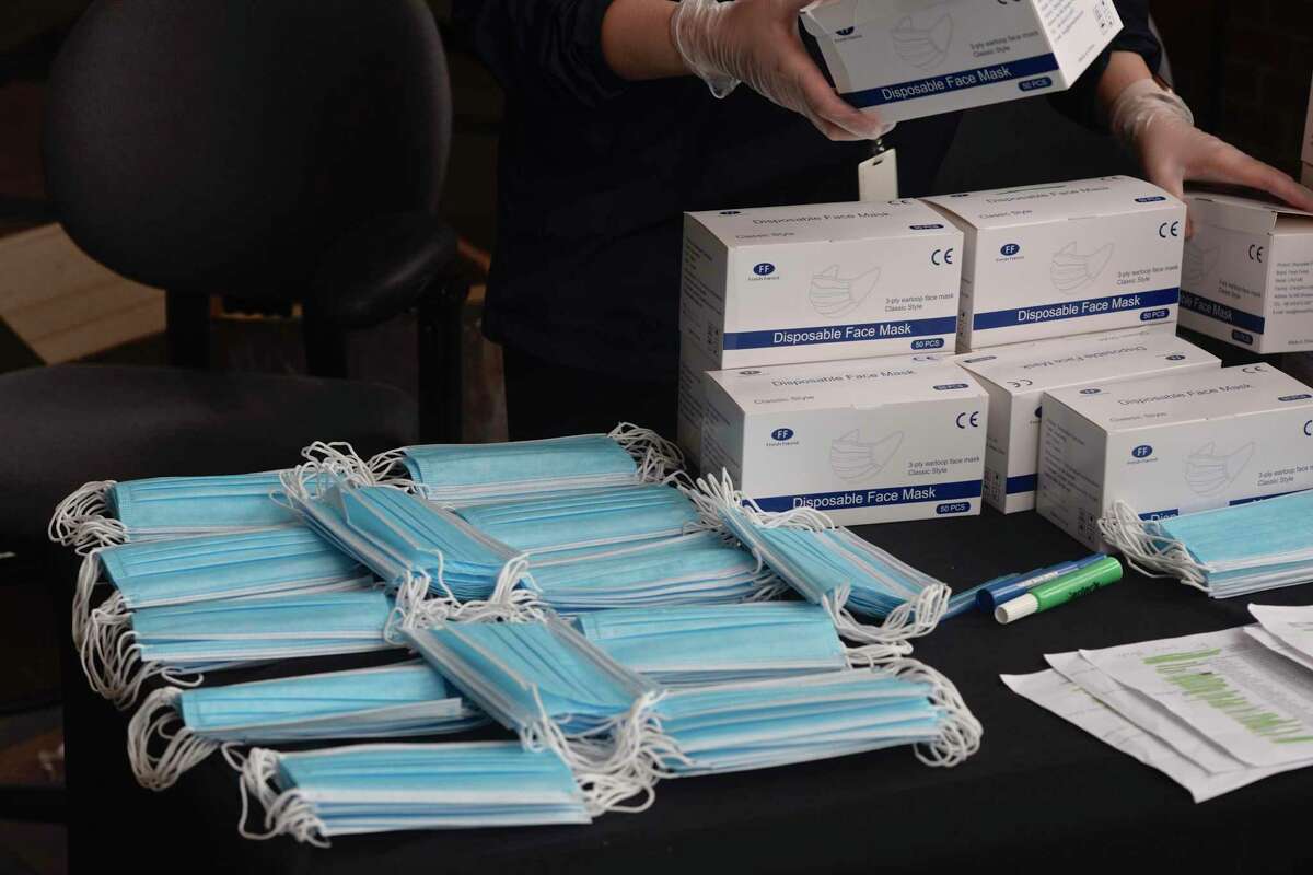 Danbury officials distributed masks to small businesses on Friday morning. Business with 50 employees or less could apply for up to two masks per employee. Friday, April 8, 2020, at City Hall, Danbury, Conn.