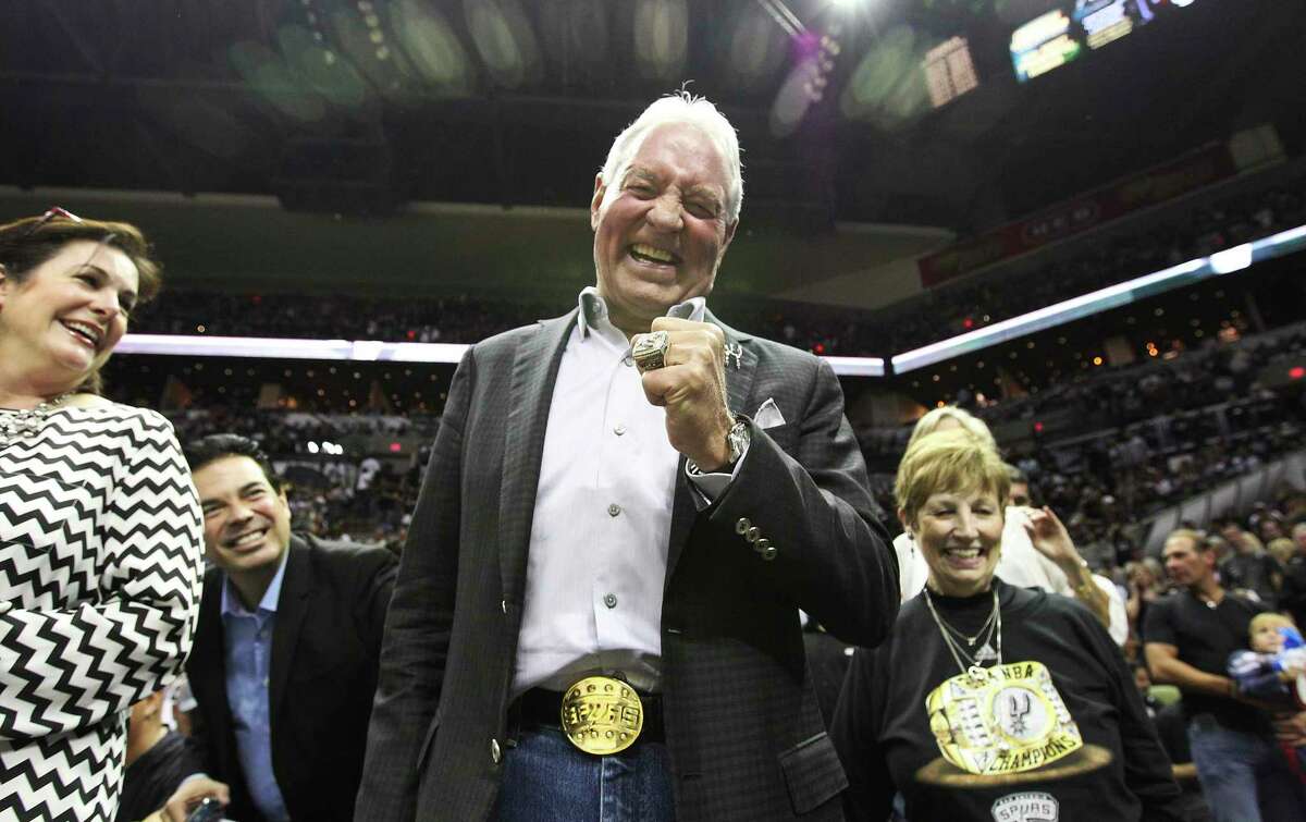 Peter M. Holt proudly wears his 2014 NBA Championship ring during the ring ceremony and season opener in 2014. He filed a counterpetition for divorce from Juliana Hawn Holt in 2018.