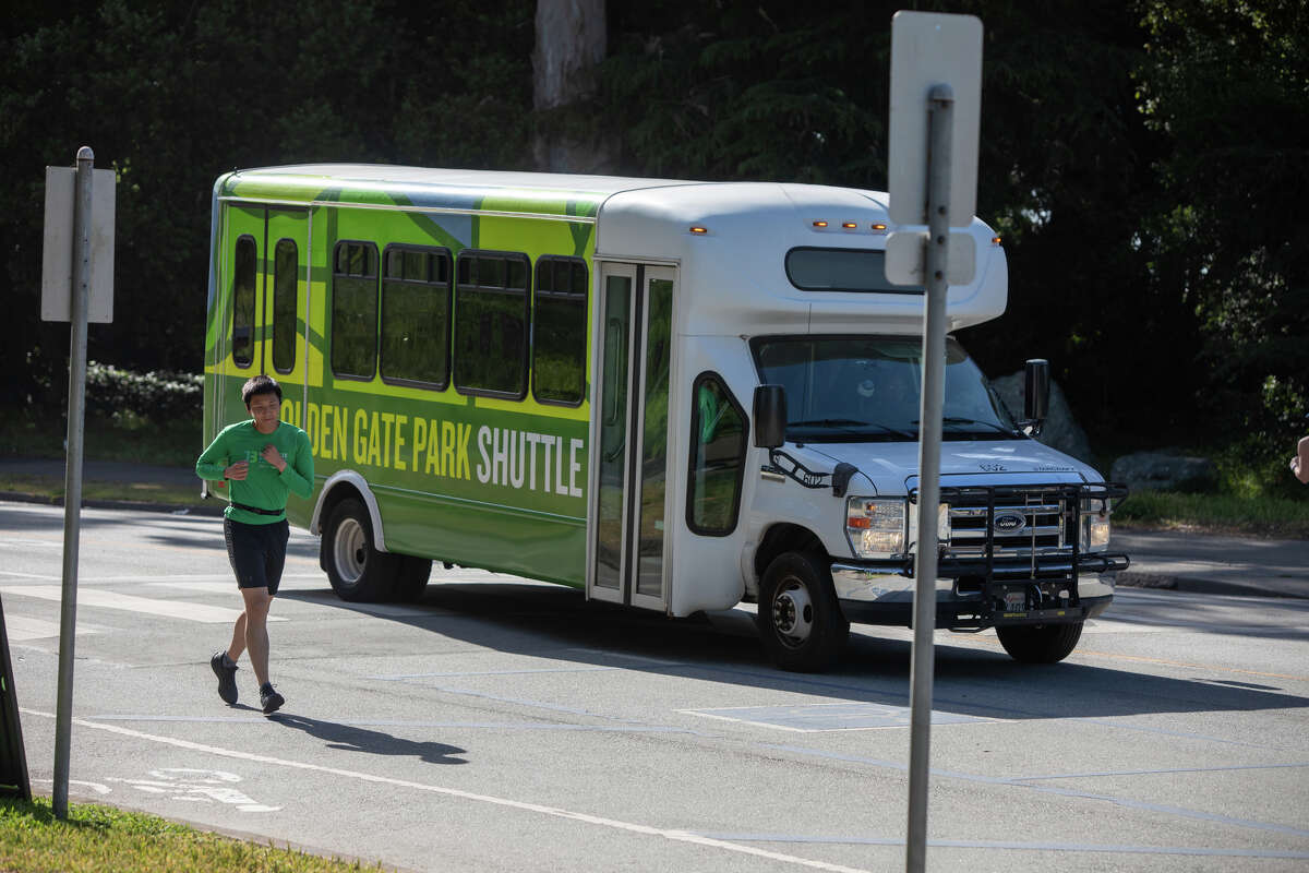 A Golden Gate Park Shuttle is the only vehicle on a 1.5 mile section of JFK Drive that is now permanently vehicle free for the use of pedestrians, bicyclists, and runners in Golden Gate Park in San Francisco, Calif. on May 17, 2022.