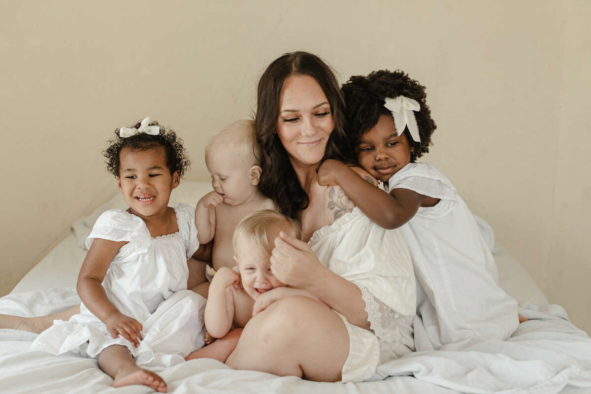 Professional photographer, Alissa Saylor surrounded by her children. 