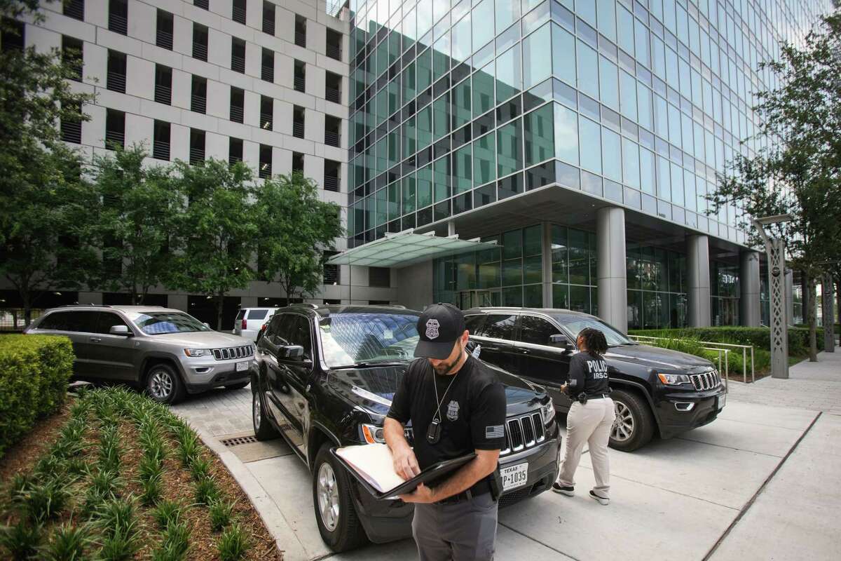 IRS agents work at the Galleria area building where the agency is conducting a court authorized investigation on a business in the 3900 block of Post Oak Friday, May 20, 2022 in Houston.