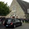 The hearse carrying James McGrath arrives at Saint Theresa Church, in Trumbull, Conn. May 20, 2022.