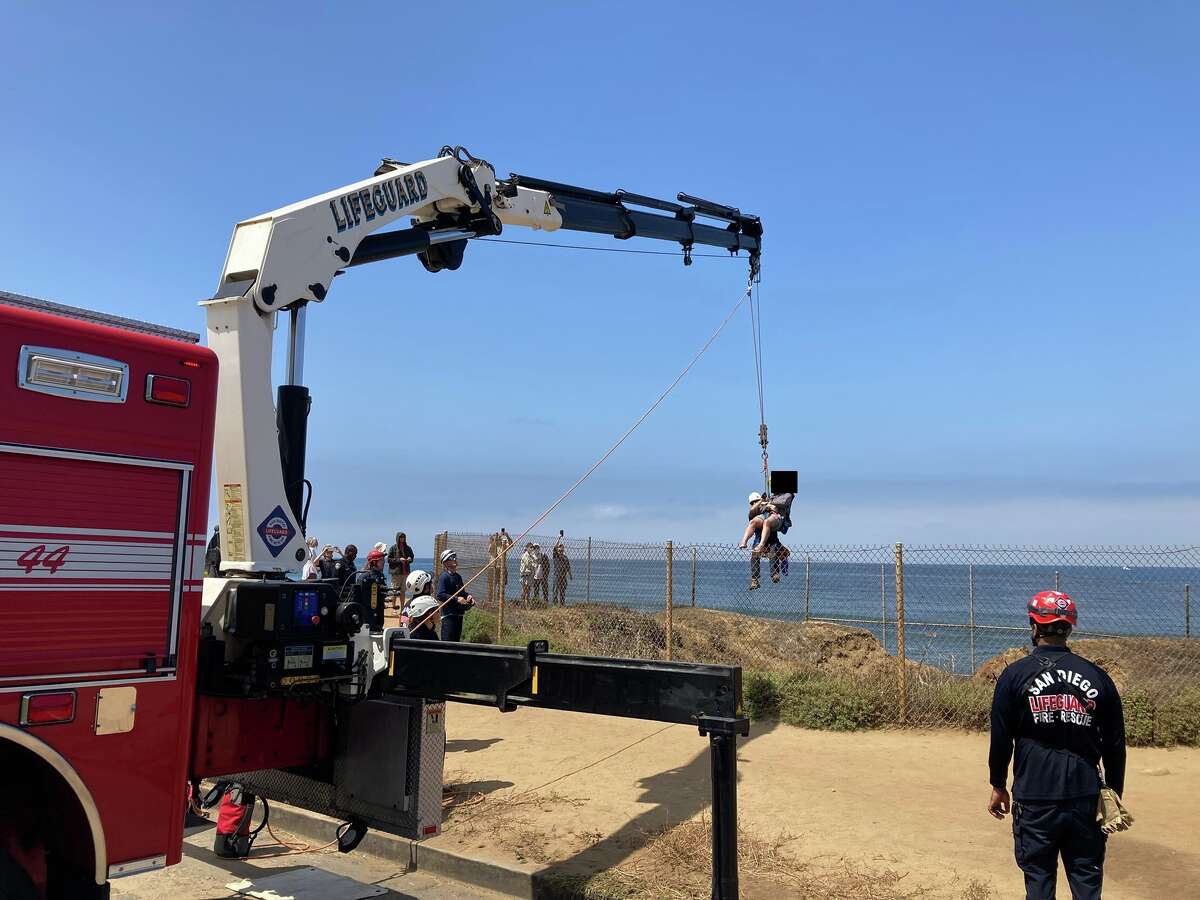 The San Diego Fire-Rescue Department rescued a man who was trapped in a sea cave known as the sinkhole at Sunset Cliffs Natural Park.