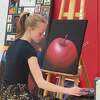 Hayley Van Wagoner demonstrates her award-winning artistic talent at the high school art show, held May 19 at Benzie Central High School. 