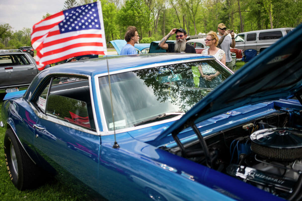 Car enthusiasts attend the Sanford Rising Car Show Friday, May 20, 2022 in Porte Park.