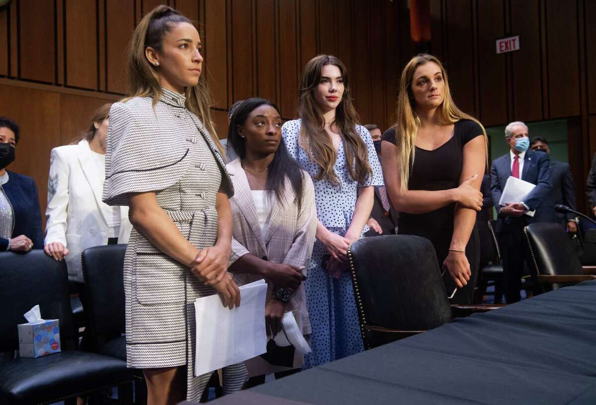 U.S. Olympic gymnasts Aly Raisman, Simone Biles, McKayla Maroney and NCAA and world champion gymnast Maggie Nichols leave after testifying during a Senate Judiciary hearing into sexual abuse.