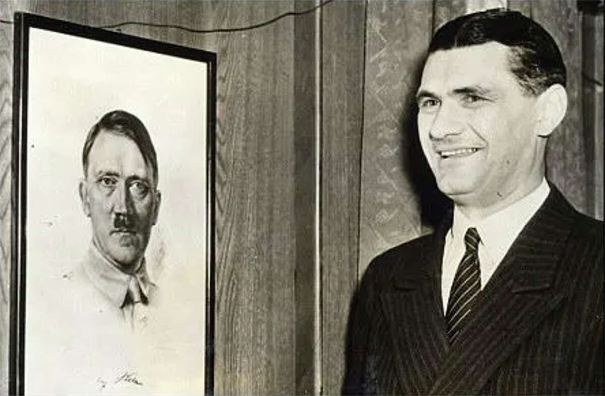 Fritz Wiedemann and a photo of his boss.