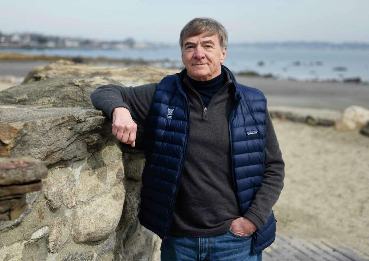 Tod's Point Sailing School founder Bill King poses on the beach at Greenwich Point Park in Old Greenwich, Conn. Thursday, March 10, 2022. The school will operate out of the Chimes Building at Greenwich Point Park and will begin programs this summer.