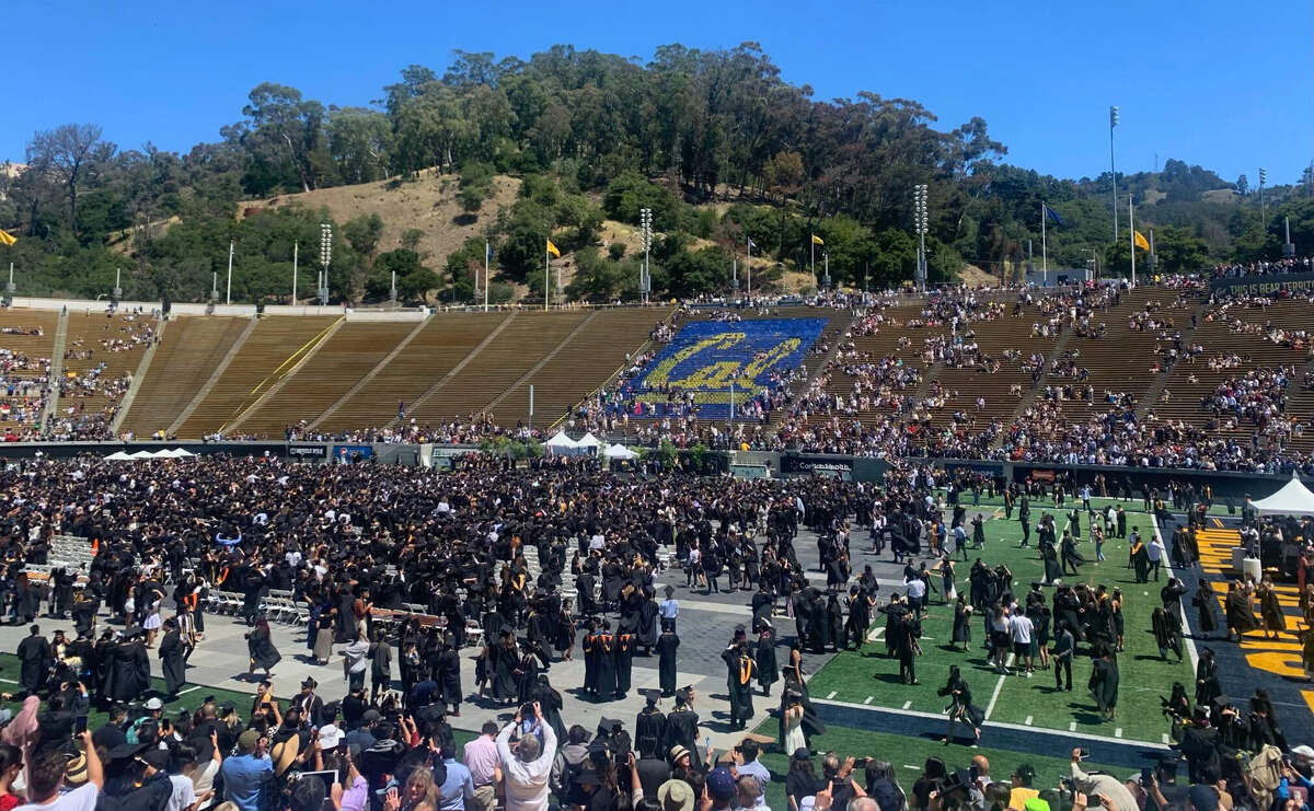 Students mill around during the UC Berkeley class of 2022 graduation.