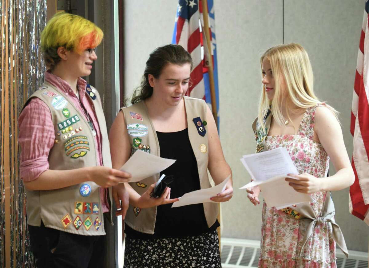 Girl Scouts Haven Sushon, left, Mikaela Browning, center, and Mary Kate Blum, who earned their Gold Awards, chat during the Greenwich Girl Scouts Service Unit Recognition Ceremony at the YWCA in Greenwich, Conn. Sunday, May 15, 2022. Senior Mikaela Browning, senior Haven Sushon, and junior Mary Kate Blum were awarded the prestigious Gold Award, the highest honor in Girl Scouts.