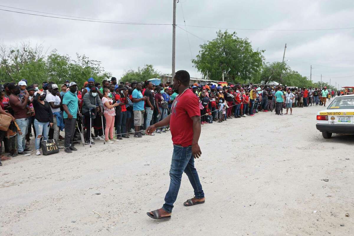 A large group of migrants gathers early this month outside the Senda de Vida shelter in Reynosa, Mexico, near McAllen.
