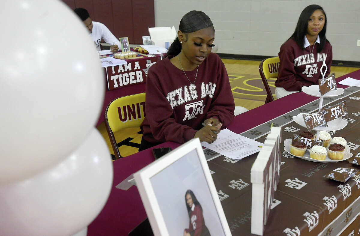 The official signing of commitment papers gets underway during a senior signing day to colleges and the military at Beaumont United. Photo made Wednesday, May 18, 2022. Kim Brent/The Enterprise