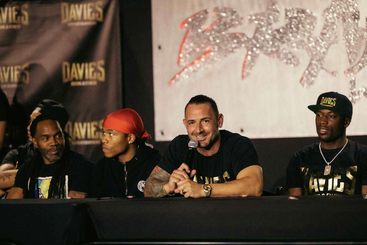 Cameron Davies speaks at recent boxing news conference, flanked by fighters (from right), Kevin Johnson, Floyd Schofield III and Schofield's father, Floyd Schofield Jr.