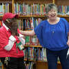 Barbara Yarbrough, left, hears the news from Christine Beal, right, that she has been selected as the LifeChanger of the Year grand prize winner. At South Elementary. Friday, May 20, 2022. TREVOR HAWES/MIDLAND ISD