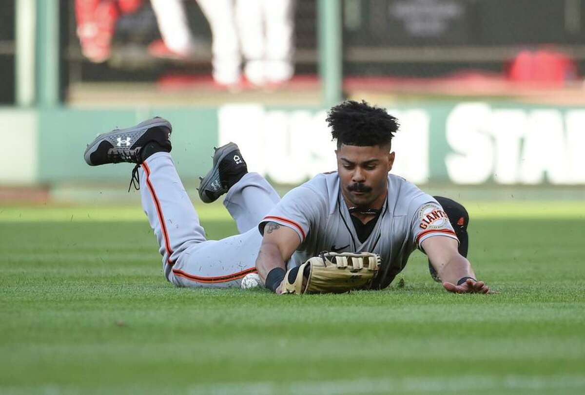 Giants outfielder LaMonte Wade Jr. was put on the IL after his knee flared up while running the bases Monday in Colorado.