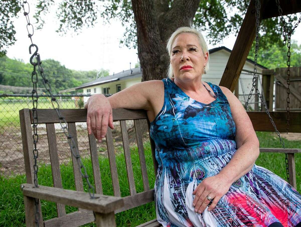 Linda Ferriulo, 62, poses for a photograph in her backyard on Friday, May 20, 2022, in Houston. After 25 years as a massage therapist, Ferriulo had her massage therapist license revoked when the Texas Department of Licensing and Regulation sent her a letter in 2020.