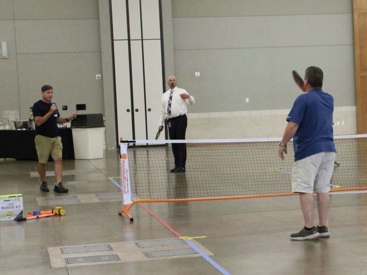 “It’s my serve” - The program last Wednesday at the Conroe Noon Lions Club was all about ‘Pickleball’. Guest speaker Don Uzell talked about the ins & outs of the sport and even played referee as club members took to the court. Pictured (l-r) Don Uzell, Club President Steve, David Fallin.