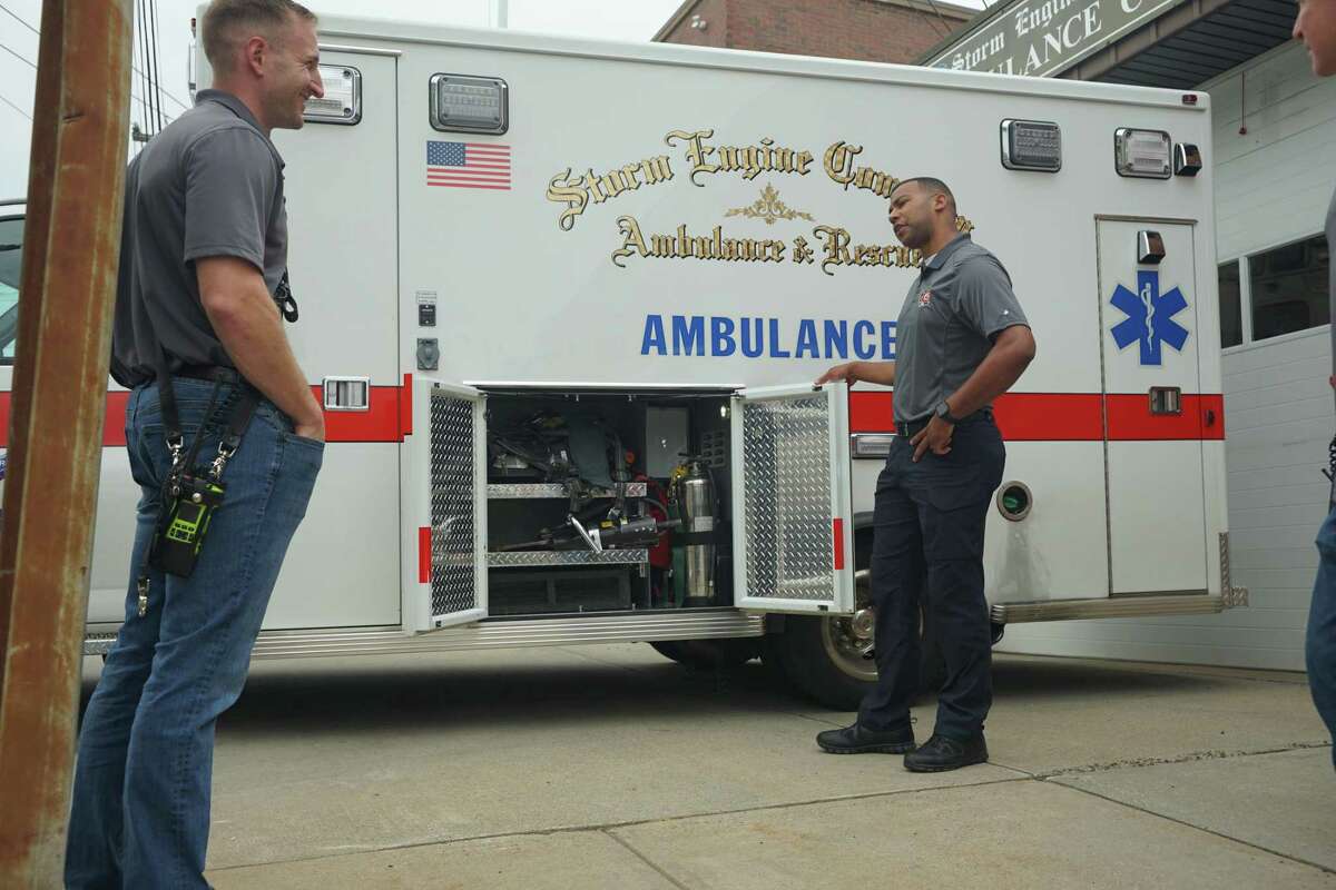 Storm Ambulance Corps Chief Javonte Ramos speaks to Northeast Fire-Rescue co-founder Tom Varanelli at the corps' headquarters on May 20, 2022 in Derby, Conn.