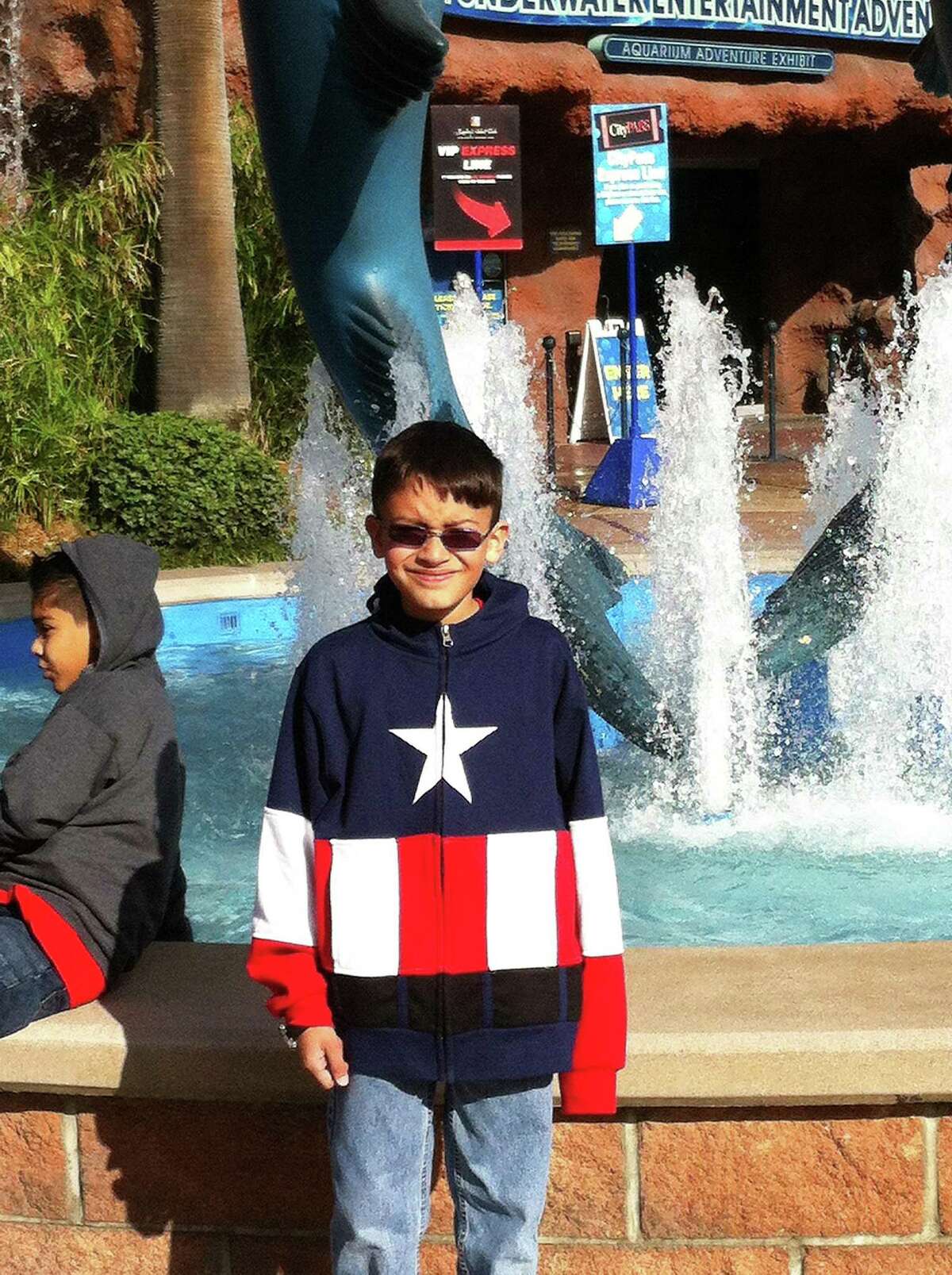Brian wears his sunglasses and a brilliant red, white, and blue sweatshirt on a visit downtown to the Aquarium Restaurant.
