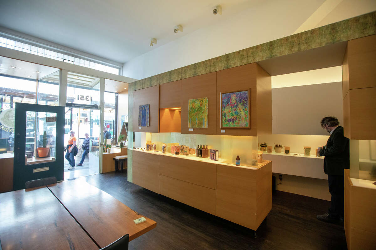 Benjamin Manton is the owner of Professor Seagull?•s Smartshop, works on a display inside his store in San Francisco, Calif. on May 19, 2022. The shop specializes in obscure and legal psychedelics.