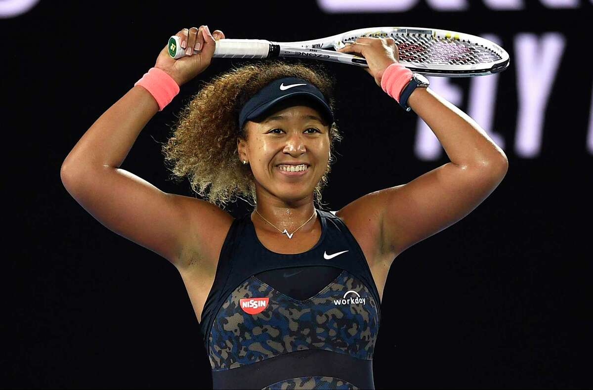 FILE -0 Japan's Naomi Osaka celebrates after defeating United States' Jennifer Brady during the women's singles final at the Australian Open tennis championship in Melbourne, Australia, Saturday, Feb. 20, 2021. The French Open is scheduled to start Sunday on the red clay of Roland Garros on the outskirts of Paris.(AP Photo/Andy Brownbill, File)