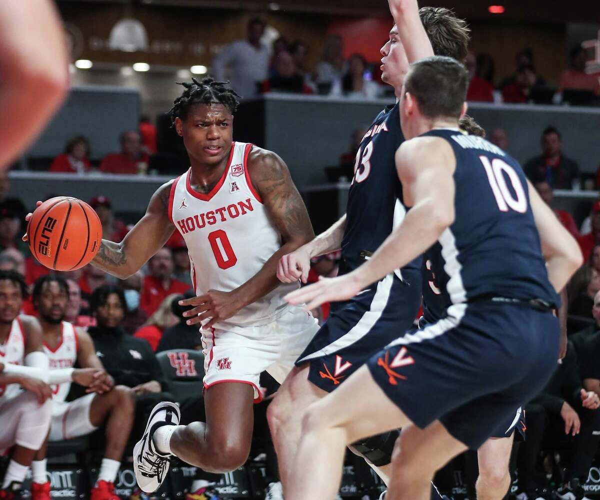 Marcus Sasser, passing against Virginia last November, was off to a strong start before a foot injury ended his season. He now must decide between the NBA draft and returning to the Cougars.