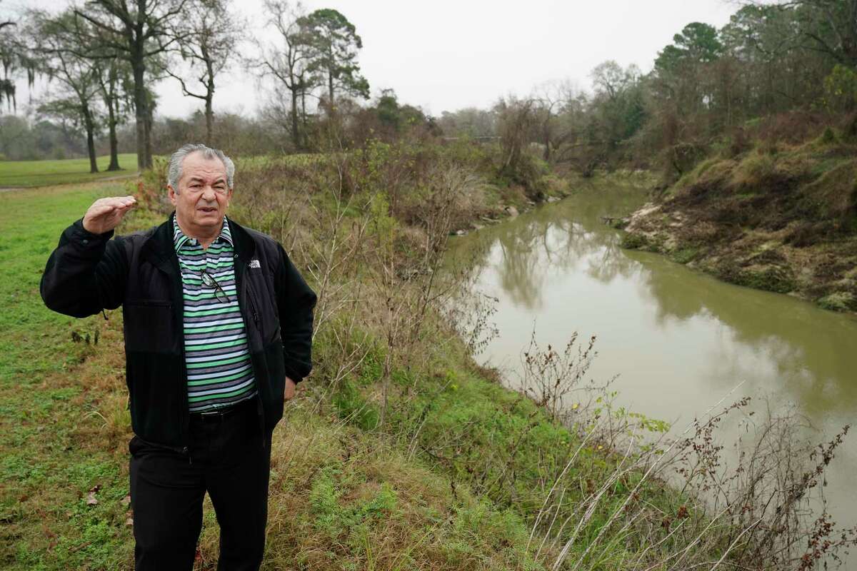 Lou Mills, marketing director, stands by Cypress Creek that borders Raveneaux County Club, 9415 Cypresswood Dr., as he talks about flooding Friday, Jan. 17, 2020, in Spring. As the Harris County Flood Control District looks for more sites to store storm water in flood events, it is increasingly turning to golf courses. The county is preparing to purchase part of Raveneaux Country Club along Cypress Creek for a detention basin.