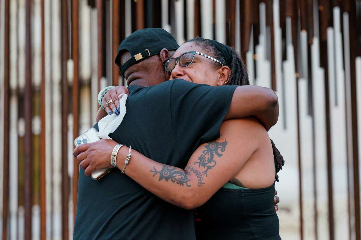“Uncle Bobby”, uncle of Oscar Grant, embraces Cat Brooks, co-founder of the Anti Police-Terror Project, during a vigil held for victims of the mass shooting in Buffalo in Oakland, Calif., on Wednesday, May 18, 2022.