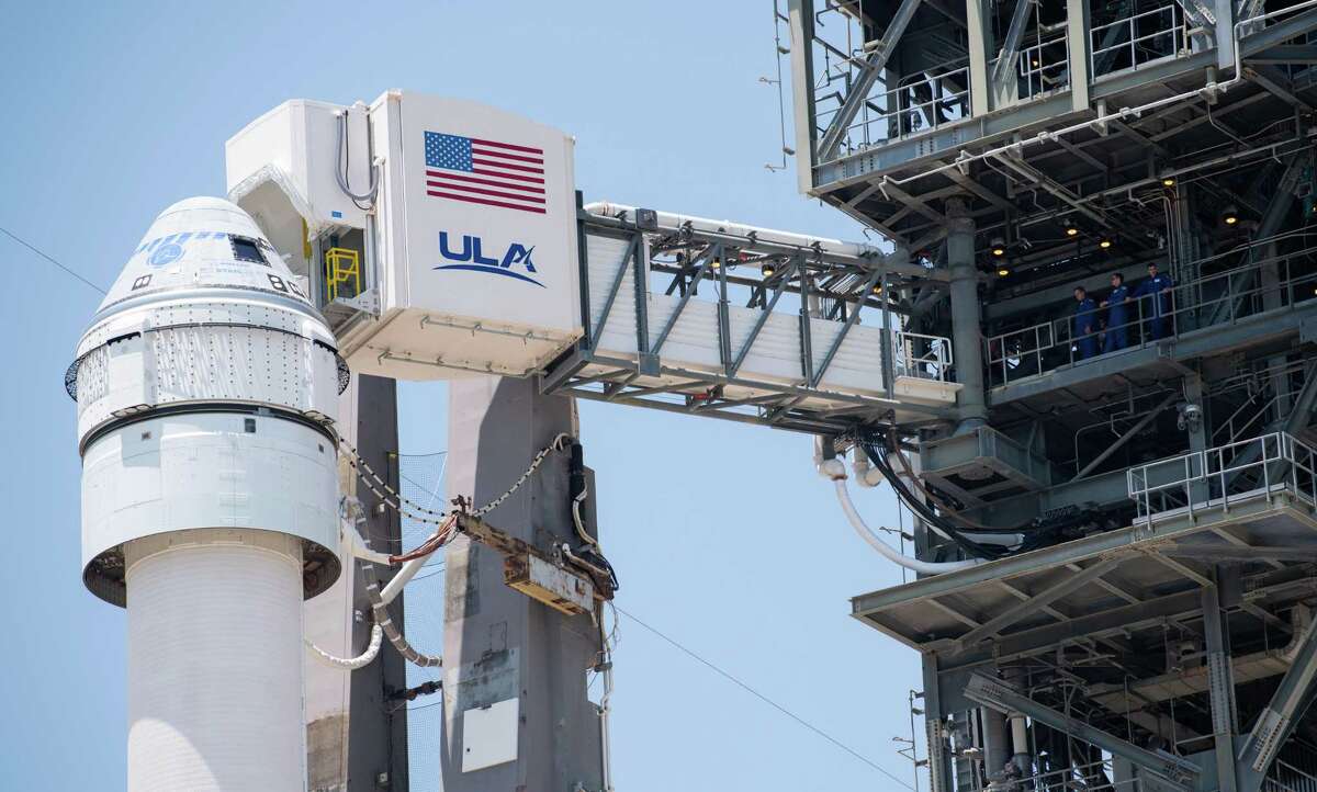 The crew access arm is seen as it swings into position for Boeing’s CST-100 Starliner spacecraft atop a United Launch Alliance Atlas V rocket on Wednesday, May 18, 2022 at Cape Canaveral Space Force Station in Florida. The rocket and spacecraft launched Thursday, May 19, 2022.