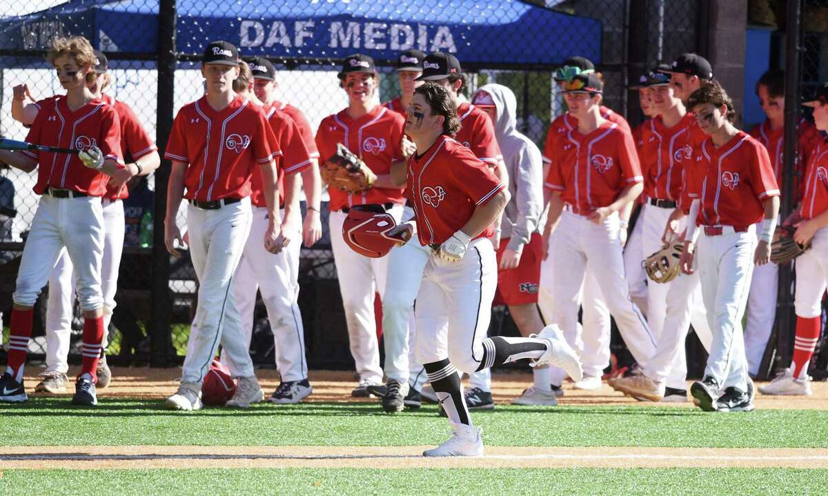 New Canaan's Alex Benevento jogs home after hitting his second home run against Darien in a baseball game played in Darien on Monday, May 9, 2022.