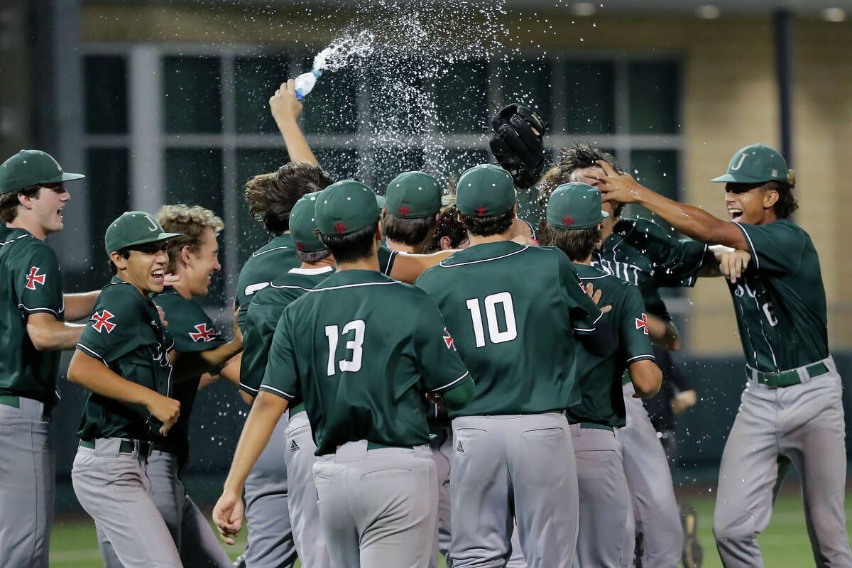 Strake Jesuit players charge the mound after their 14-9 win over Summer Creek after their Region III-6A quarterfinal baseball game held at the University of Houston Friday, May 20, 2022 in Houston, TX.