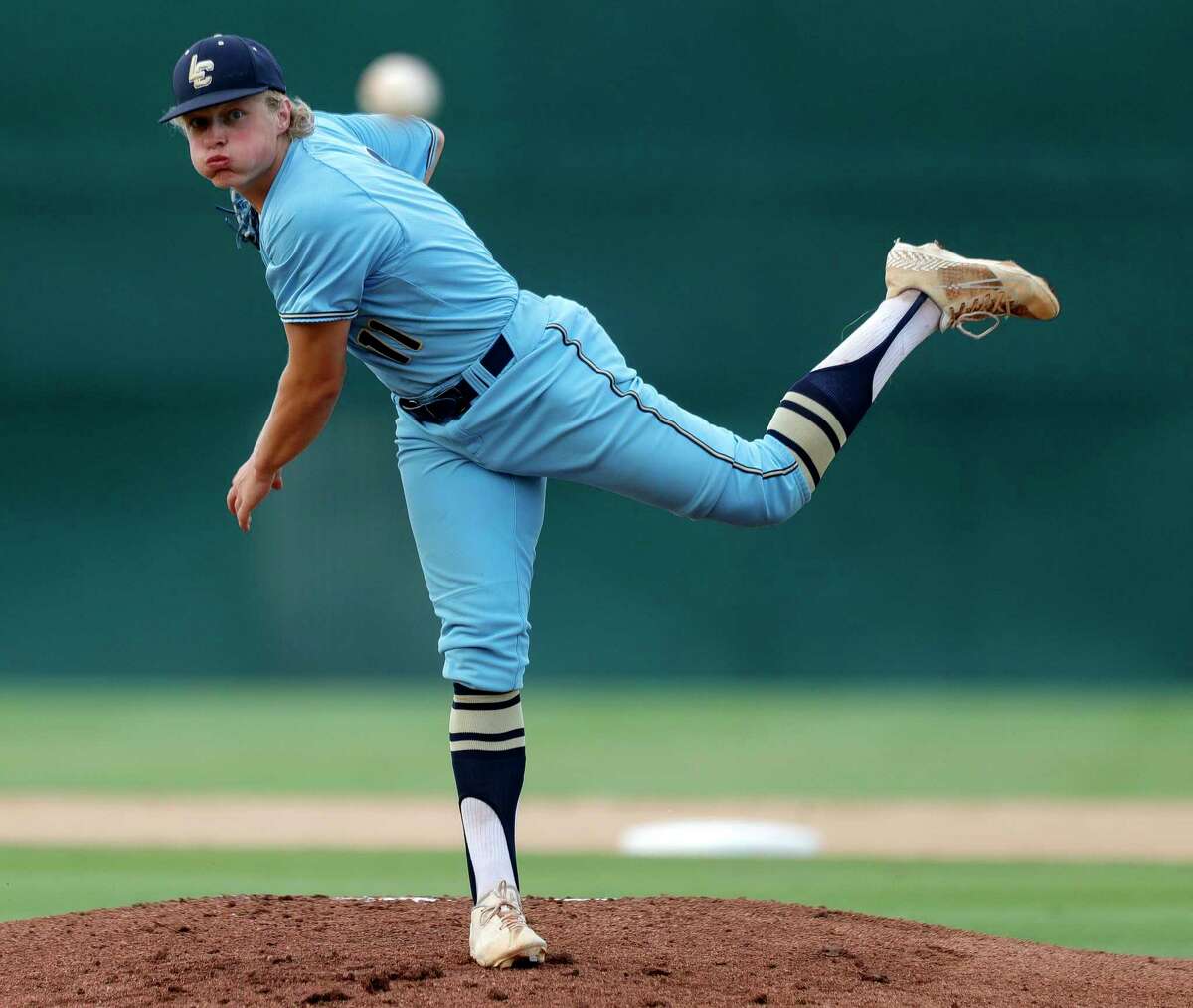 Lake Creek starting pitcher Jackson Wilkerson (11) throws in the first inning of Game 2 of a Region III-5A quarterfinal high school baseball playoff series at Magnolia High School, Friday, 20, 2022, in Magnolia.