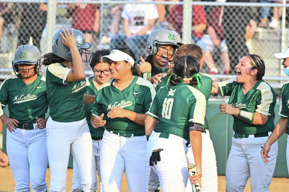 McCollum’s Rosalyn Hughes celebrates with her teammate after hitting a home run in the top of the first inning of Fridays 5A regional quarterfinal game against Corpus Christi Flour Bluff. At Beeville High School in Beeville Texas.