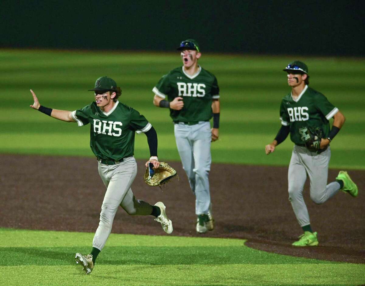 Reagan centerfielder Britton Moore waves after throwing out a Smithson Valley runner at home plate during Class 6A regional quarterfinal playoffs at North East Sports Park on Friday, May 20, 2022. Reagan won the game, 3-2, and the series.
