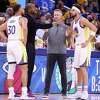 Golden State Warriors’ Stephen Curry, Andre Iguodala, head coach Steve Kerr and Klay Thompson meet in 4th quarter of 126-117 win over Dallas Mavericks during Game 2 of NBA Western Conference Finals at Chase Center in San Francisco, Calif., on Friday, May 20, 2022.