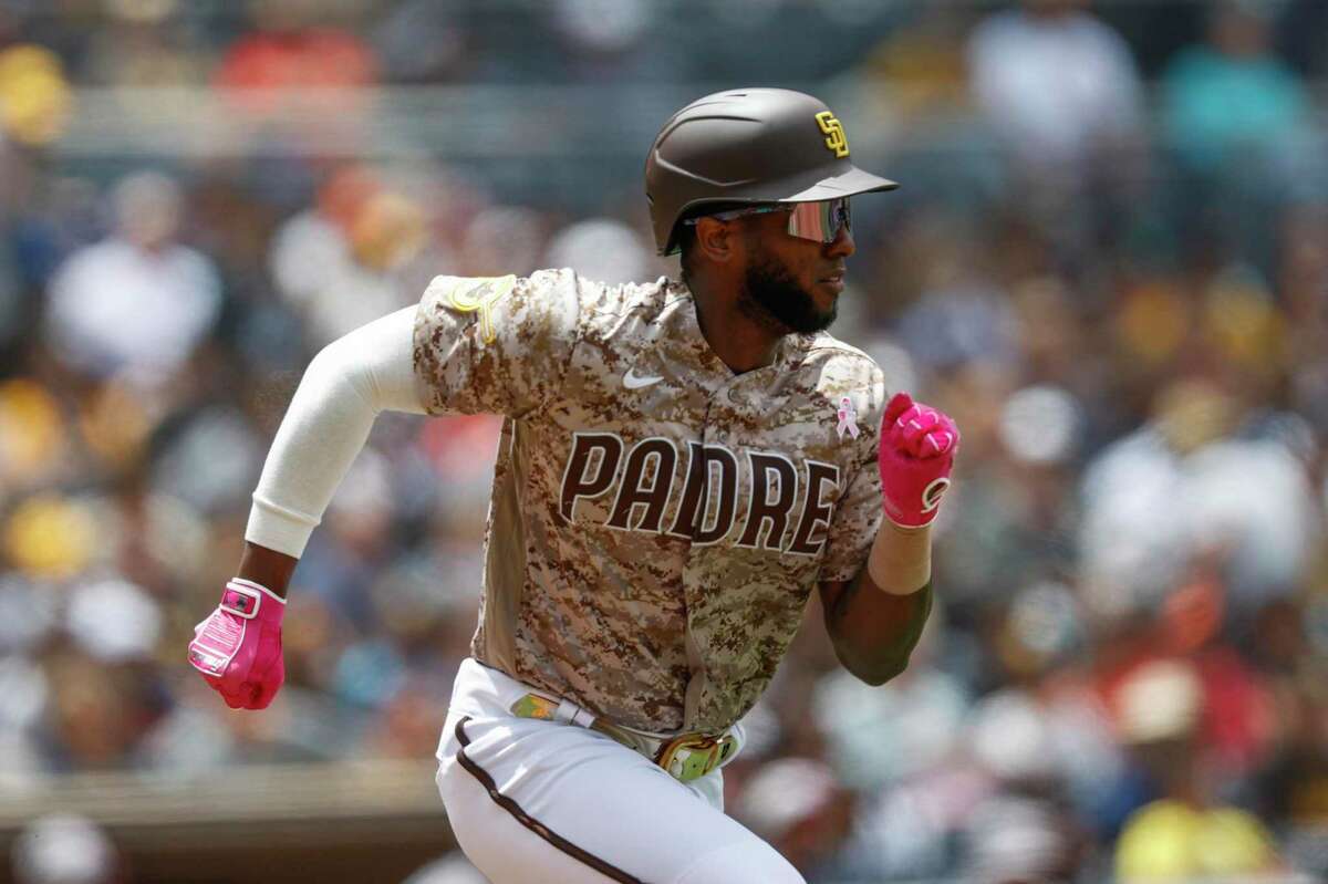 San Diego Padres Jurickson Profar runs to first base against the Miami Marlins during the baseball game Sunday, May 8, 2022, in San Diego. (AP Photo/Mike McGinnis)