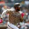 San Diego Padres Jurickson Profar runs to first base against the Miami Marlins during the baseball game Sunday, May 8, 2022, in San Diego. (AP Photo/Mike McGinnis)