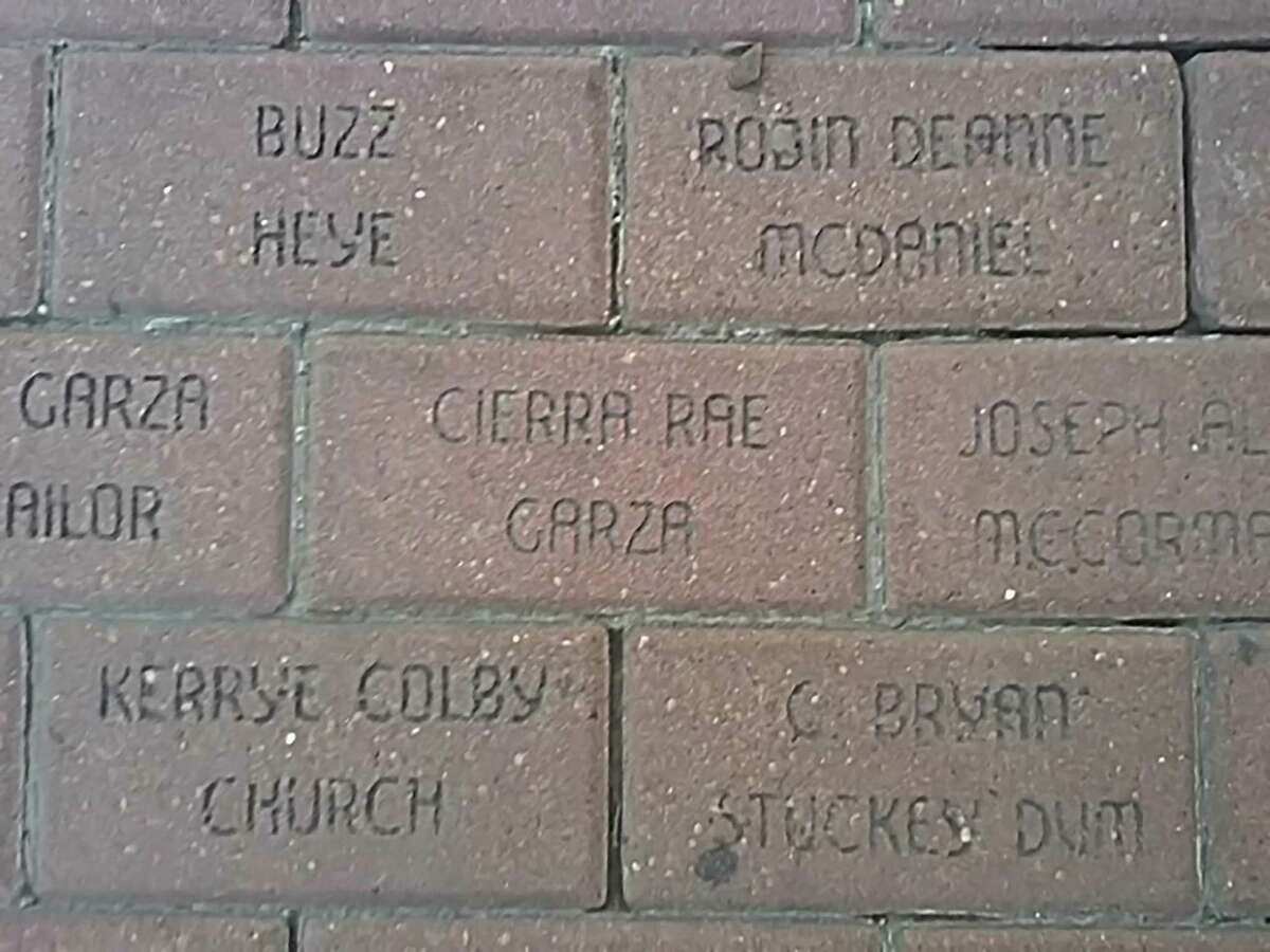 Engraved brick pavers like these were sold from 1989 to 1991 to fund improvements to Houston Street sidewalks.