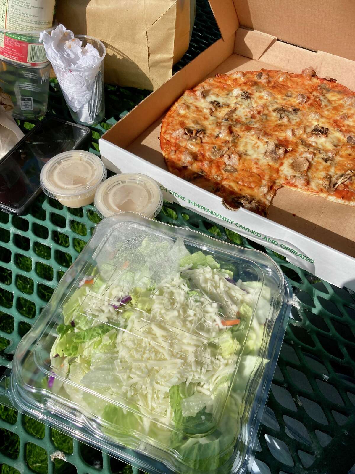 The famous Imo's pizza, with Italian sausage and mushrooms, that's thin crust and always with Provel cheese and the restaurant's famous salad with Imo's house Italian dressing. The Mother's Day Special also included toasted ravioli and garlic bread.