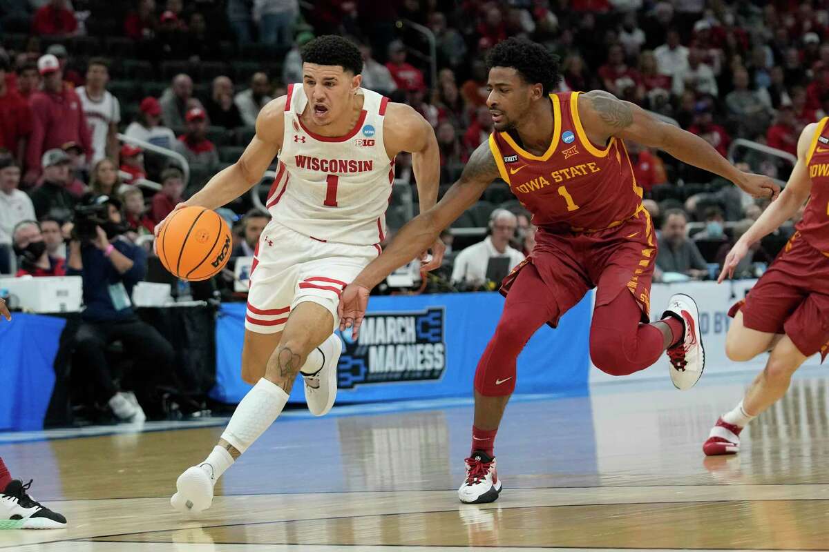 MILWAUKEE, WISCONSIN - MARCH 20: Johnny Davis #1 of the Wisconsin Badgers dribbles the ball in front of Izaiah Brockington #1 of the Iowa State Cyclones during the first half in the second round of the 2022 NCAA Men's Basketball Tournament at Fiserv Forum on March 20, 2022 in Milwaukee, Wisconsin. (Photo by Patrick McDermott/Getty Images)