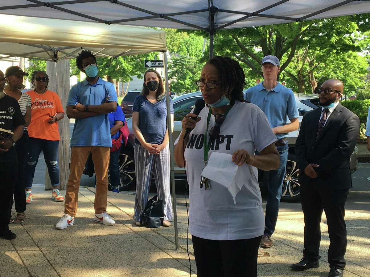 Jeanette Sykes, chairwoman of the steering committee of the Newhallville-Hamden Strong community group speaks to other attendees at a press conference-prayer hour on May 21, 2022 in opposition to the APT Foundation's proposal to put a methadone clinic at  794 Dixwell Ave. in New Haven.