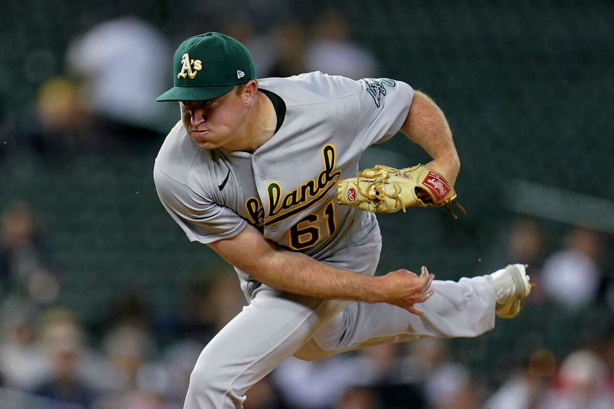 Oakland Athletics relief pitcher Zach Jackson throws against the Detroit Tigers in the seventh inning of a baseball game in Detroit, Monday, May 9, 2022. (AP Photo/Paul Sancya)
