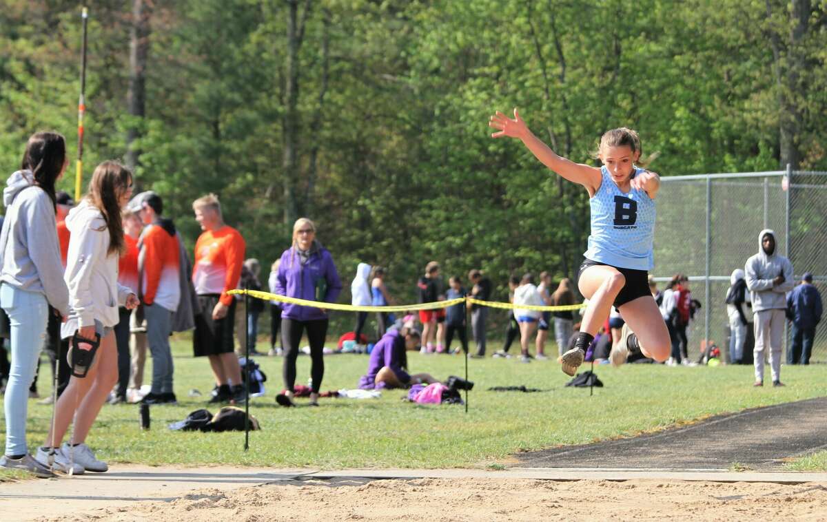 Brethren sophomore Abby Kissling competes in the long jump during regionals on Saturday, May 21 at Brethren High School. Kissling broke the school record in long jump for the second time in five days after never competing in the event while qualifying for state. 